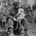 9th Armored Division technician with a little French girl on Valentine’s Day – 1945