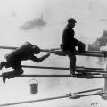 Brooklyn Bridge painters at work high above the city – 1915