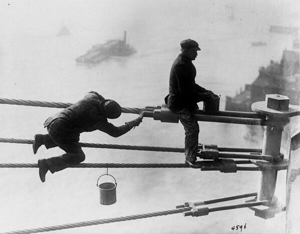 Brooklyn Bridge painters at work high above the city - 1915