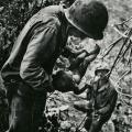 Bambino ferito con Marines, Saipan, 1944 by W. Eugene Smith