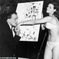 Salvador Dali kisses the hand of Raquel Welch after finishing his famous portrait of her, 1965