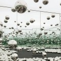 Yayoi Kusama, Infinity Mirrored Room—Let’s Survive Forever, 2017, wood, metal, glass mirrors, LED lighting system, monofilament, stainless steel balls, carpet, 10′ 3“ x 20′ 6” x 20′ 5 1/4″