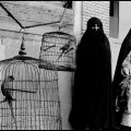 IRAN. Shiraz. 1956. Veiled Muslim women and caged cockatoos (wives of one man).