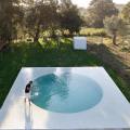 Architect Guilherme Machado Vaz takes influence from the early modernist movement with the “Afife House” in northern Portugal. The residence faces away from the road and toward an artfully planned swimmingpool in the yard. Photography by Jose Campos