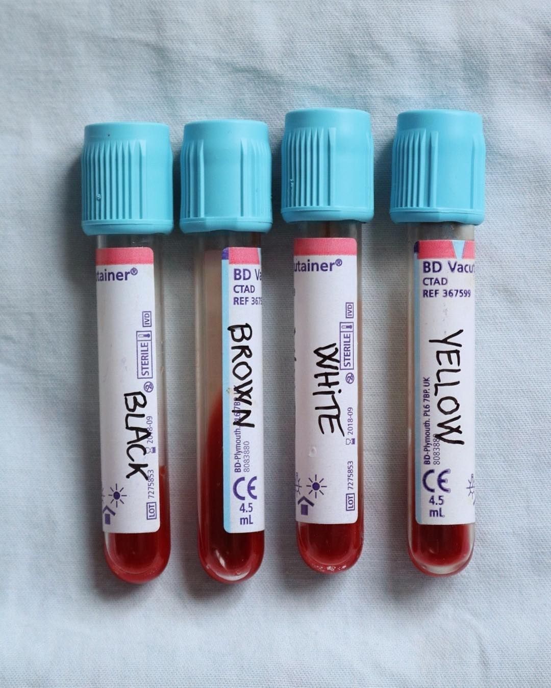 By Cecile Hoodie "Just a reminder: we all bleed the same color (for people who feel offended by the yellow tube, I put it because I wanted the different colors that people give to the different skins are represented. it’s precisely to point out the shortcuts and the judgments that we can made. I dont say it's good to call the Asian by the Yellow color)"