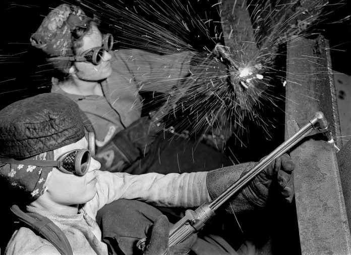 INDIANA, UNITED STATES – 1942: Female welders at work in a steel mill, replacing men called to duty during World War II. (Photo by Margaret Bourke-White/The LIFE Picture Collection via Getty Images)