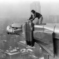 Margaret Bourke-White, a photographer for LIFE magazine, makes a precarious photo from one of the eagles on the 61st floor of the Chrysler Building in New York City in 1934