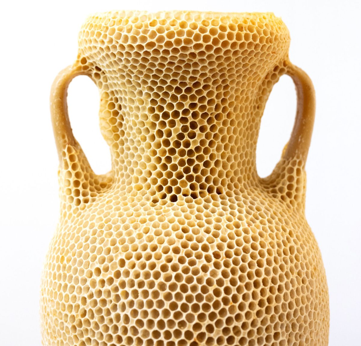 “The Honeycomb Amphora” (2020), natural beeswax, museum glass, wood, re-used beehives , 47 x 42 x 147 centimeters. All images © Tomáš Libertíny