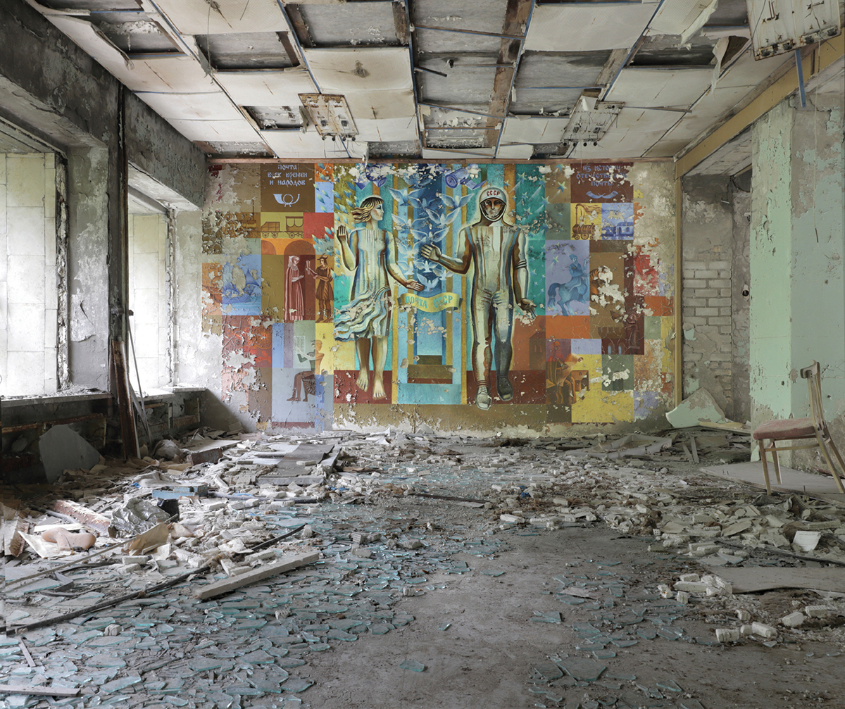 ost Office, Pripyat. The mural illustrates the evolution of communication, from stone tablets and scrolls, to mail trains and finally a Soviet cosmonaut. Chernobyl Exclusion Zone by Darmon Richter