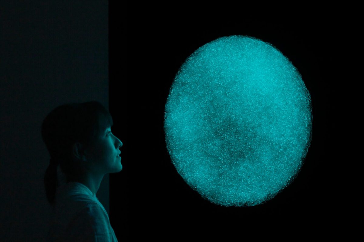 Rui Sasaki. “Weather Mirror” (2021), glass, phosphorescent crystal mixture, mirror, foot switch. Photo by Kichiro Okamura