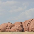 “The Son of the Earth” was created by Professor Dong Shubing of Tsinghua University in the Gobi Desert in Hongshanpo, Guazhou County, Gansu Province. The sculpture is 15 meters long, 4.3 meters high and 9 meters wide. The title of the work means that we are all the children of the earth.  The design and construction of it was organized by Professor Dong Shubing, who also raised the funds needed. After the construction, it was given to the local people free of charge. Professor Dong Shubing said that the reason for the construction of the “giant baby” was to protect the local living environment. Later, it became a landmark building on the desolate land of Guazhou.