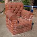 Brick sofa sculpture by Rodney Harris