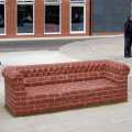 Brick sofa sculpture by Rodney Harris