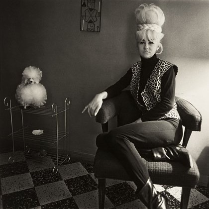 "Lady Bartender at Home with a Souvenir Dog" by Diane Arbus