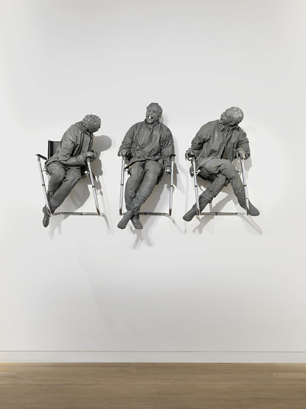 "Three Laughing at One" by Juan Muñoz